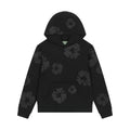 Denim Tears Black Mono Wreath Hoodie with monochrome puff-print wreath graphic, soft fleece fabric, and relaxed fit for bold streetwear appeal