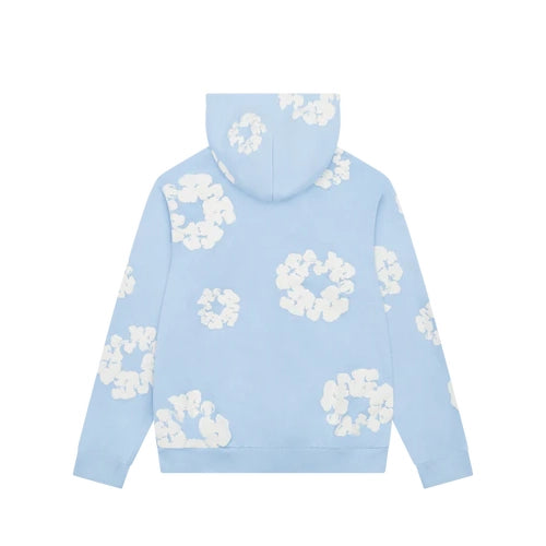 Denim Tears Cotton Wreath Sweatshirt in Powder Blue with puff-printed wreath design, soft cotton fabric, and relaxed fit for elevated streetwear style