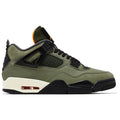 Undefeated x Air Jordan 4 (2025 reissue) in olive nubuck with black wings/eyelets, Nike Air heel tab, orange lining, Velcro tongue patches, off-white midsole, visible heel Air unit.