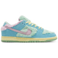 Verdy x Nike Dunk Low SB 'Visty' with green furry upper, pastel blue suede, pink Swoosh, yellow midsole, and Visty character branding on tongue and insole