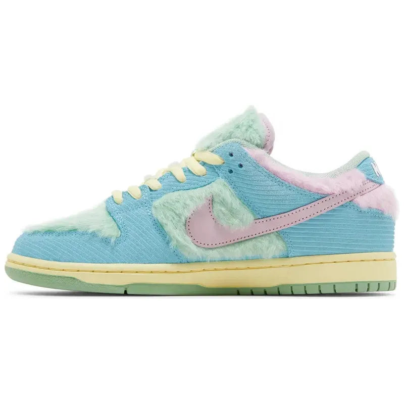 Verdy x Nike Dunk Low SB 'Visty' with green furry upper, pastel blue suede, pink Swoosh, yellow midsole, and Visty character branding on tongue and insole