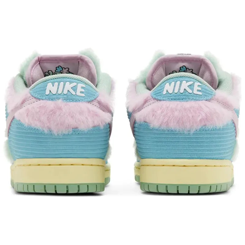 Verdy x Nike Dunk Low SB 'Visty' with green furry upper, pastel blue suede, pink Swoosh, yellow midsole, and Visty character branding on tongue and insole